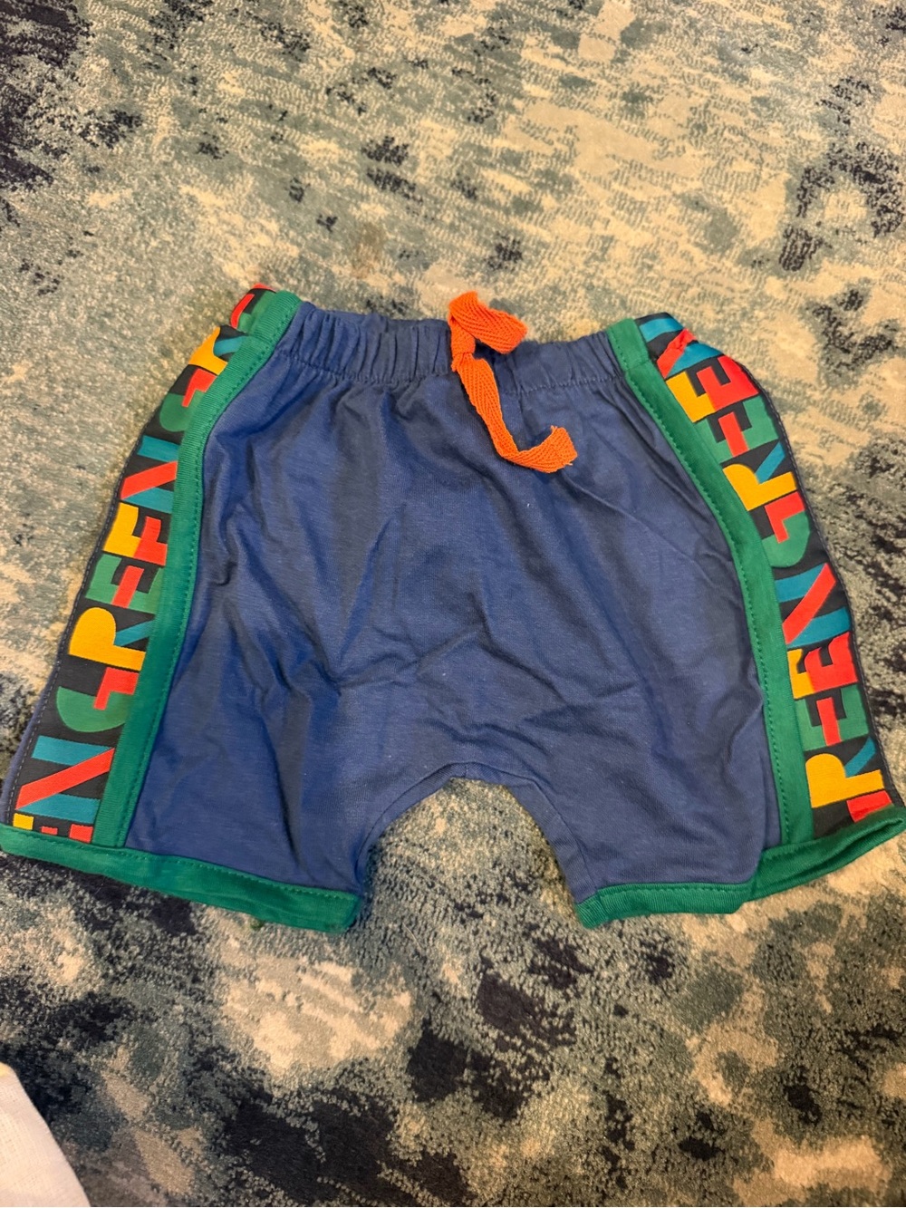 Kids Blue Athletic Shorts with Green Trim and Orange Drawstring